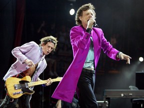Rolling Stones lead singer Mick Jagger (right) and Keith Richards perform at the Concert for SARS Relief at Downsview Park in Toronto Wednesday July 30, 2003.