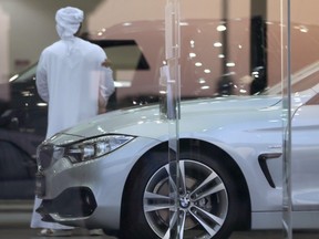 A man visits a car showroom in Dubai