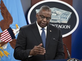 FILE - Secretary of Defense Lloyd Austin speaks during a news conference with Chairman of the Joint Chiefs of Staff Gen. Mark Milley at the Pentagon in Washington, on July 18, 2023. Austin met with Papua New Guinea leaders on Thursday, July 27, 2023 to discuss developing the Pacific Island nation's military strength and deepening security ties, as the United States competes with China for influence in the Indo-Pacific region.