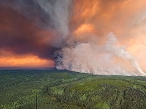 The Donnie Creek wildfire burns in an area between Fort Nelson and Fort St. John, B.C., in this undated handout photo provided by the BC Wildfire Service. Hundreds of lightning strikes in many parts of British Columbia almost tripled the number of active wildfires in the province over the weekend, with the majority burning in central and northern B.C.