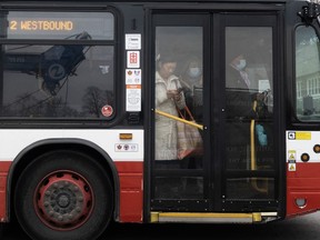 People ride on a shuttle bus outside a west-end Toronto subway stop after subway service was closed during the morning commute Wednesday, April 5, 2023. Toronto had the least reliable transit system in 2022 compared to other municipalities in the region, according to newly released transit report cards from the Toronto Region Board of Trade.