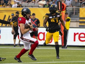 Ottawa Redblacks quarterback Dustin Crum (18) runs into the end zone for a touchdown during first half CFL football game action against the Hamilton Tiger-Cats in Hamilton, Ont. on Saturday, July 8, 2023. Crum is going to make history Saturday afternoon, whether he wins or loses.