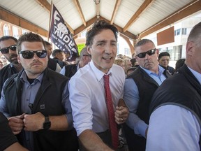 Prime Minister Justin Trudeau surrounded by his security detail in Belleville, Ontario.