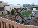 An aerial view shows a newly constructed X sign on the roof of the headquarters of the social media platform previously known as Twitter, in San Francisco, on July 29, 2023. 
