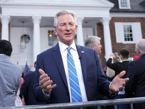 FILE - Sen. Tommy Tuberville, R-Ala., talks during a television interview before former President Donald Trump speaks at Trump National Golf Club in Bedminster, N.J., June 13, 2023. Tuberville is backing off his defense of white nationalists, telling reporters in the Capitol that white nationalists "are racists." Tuberville's brief comment Tuesday, July 11, follows several media interviews in which he has repeatedly declined to describe white nationalists as racist.
