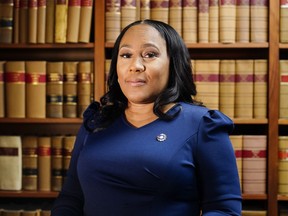 FILE - Fulton County District Attorney Fani Willis poses for a portrait, April 19, 2023, in Atlanta. A new grand jury being seated this week in Atlanta will likely consider whether criminal charges are appropriate for former President Donald Trump or his allies for their efforts to overturn his 2020 election loss in Georgia. Willis has been investigating since shortly after Trump called Georgia Secretary of State Brad Raffensperger to ask him to find just enough votes to beat Democrat Joe Biden.