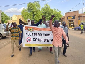 Supporters of Nigerien President Mohamed Bazoum demonstrate in his support in Niamey, Niger, Wednesday July 26, 2023. Governing bodies in Africa condemned what they characterized as a coup attempt Wednesday against Niger's president, whose official Twitter account reported that elements of the presidential guard engaged in an "anti-Republican demonstration" and tried to obtain the support of other security forces.