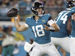 Jacksonville Jaguars quarterback Nathan Rourke (18) stands back to pass during the second half of an NFL preseason football game against the Miami Dolphins, Saturday, Aug. 26, 2023, in Jacksonville, Fla.