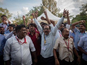 Employees of the Indian Space Research Organisation celebrate after the successful landing of the Chandrayaan-3 mission on the moon's south pole on Wednesday.