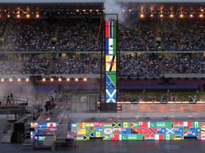 Artists perform as flags of Commonwealth countries are displayed during the Commonwealth Games closing ceremony at the Alexander stadium in Birmingham, England, Monday, Aug. 8, 2022. Alberta's government has pulled the plug on a possible 2030 Commonwealth Games bid citing financial risk.THE CANADIAN PRESS/AP, Kirsty Wigglesworth