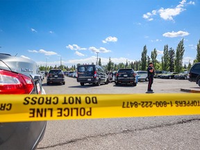 Calgary police contain the scene of a shooting in the parking lot outside the south entrance of Market Mall on Saturday, August 12, 2023. One person was killed.