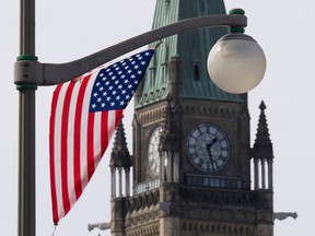 A United States flag is seen on a lamp post in the downtown area near Parliament Hill, Wednesday, March 22, 2023 in Ottawa.