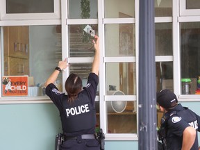 Toronto Police investigate a bullet hole in a daycare centre.