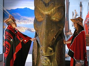 Amy Parent, right, is shown with the Ni'isjoohl memorial pole alongside Nisga'a Chief Earl Stephens during a visit to the National Museum of Scotland.
