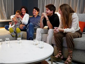 Justin Trudeau watches election results with wife Sophie Grégoire Trudeau and their children.