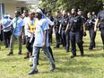 Toronto Police work the scene of a protest that turned violent in Earlscourt Park in Toronto, on Saturday, August 5 2023. Toronto police say one person was stabbed and eight others were injured during a protest in the city's west end.