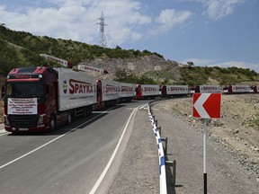 FILE - Trucks with humanitarian aid for Artsakh parked in a road towards the separatist region of Nagorno-Karabakh, in Armenia, on July 28, 2023. Armenia called on the U.N. Security Council to hold an emergency meeting on the worsening humanitarian situation in Azerbaijan's Nagorno-Karabakh region, which is mostly populated by Armenians. In his letter to the president of the U.N. Security Council, sent Friday and released by Armenia's Foreign Ministry on Saturday Aug. 12, 2023, Armenian U.N. ambassador Mher Margaryan said the people of Nagorno-Karabakh were "on the verge of a full-fledged humanitarian catastrophe."