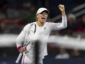 Iga Swiatek of Poland, reacts during her game against Danielle Collins of the United States, during quarterfinal action at the National Bank Open tennis tournament in Montreal, Friday, Aug.11, 2023.