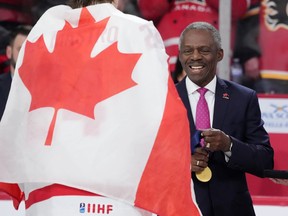 Hugh Fraser, Hockey Canada Board Chair, prepares the gold medals during the medal ceremony of the IIHF World Junior Hockey Championship gold medal game in Halifax on Thursday, January 5, 2023.