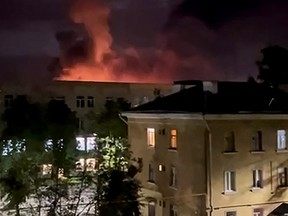 An explosion lights up the sky as the Russian military faces a drone attack.