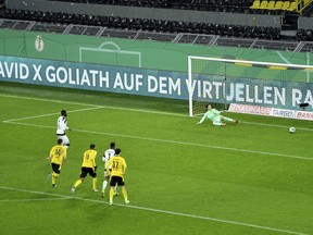 Paderborn's Prince Osei Owusu scores his side's second goal of the game from the penalty spot during the German Soccer Cup 3rd round match between Borussia Dortmund and SC Paderborn 07 at Signal Iduna Park in Dortmund, Germany, Tuesday, Feb. 2, 2021.&ampnbsp;Owusu has signed with Toronto FC through 2024 with an option for 2025. THE CANADIAN PRESS/Frederic Scheidemann/Pool photo via AP)