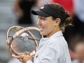 Jessica Pegula from the United States poses with the trophy after winning the final of the National Bank Open tennis tournament against Liudmila Samsonova from Russia in Montreal, Sunday, August 13, 2023.