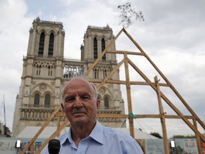 FILE - General Jean-Louis Georgelin who is to oversee reconstruction of Notre Dame Cathedral, attends an interview in front of Notre Dame Cathedral in Paris, France, Saturday, Sept. 19, 2020. The decorated French general in charge of big-budget restoration work on fire-ravaged Notre Dame Cathedral in Paris has died on Saturday, Aug. 19, 2023. Jean-Louis Georgelin was 74.