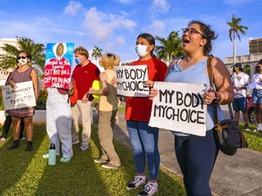 FILE - "My body, my choice!" resonates from protesters on the front lawn of the Guam Congress Building in Hagåtña during a protest as they voiced their concerns against the Guam Heartbeat Act of 2022 on April 27, 2022. A federal appeals court says women seeking medication abortions on the U.S. Territory of Guam must first have an in-person consultation with a doctor even though the nearest physician willing to prescribe the medication is 3,800 miles (6,100 kilometers) and an 8-hour flight away.
