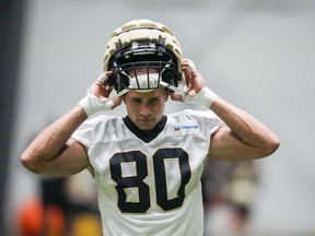 New Orleans Saints tight end Jimmy Graham (80) dons his helmet at the NFL team's football training camp in Metairie, La., Friday, Aug. 4, 2023.