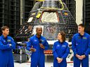 The crew of Artemis II, from left: U.S. astronauts Reid Wiseman, commander; Victor Glover, pilot; Christina Hammock Koch, mission specialist; and Canadian astronaut Jeremy Hansen, mission specialist, speak in front of the Artemis II crew module  at Kennedy Space Center in Cape Canaveral, Florida, on August 8, 2023.