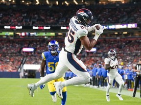 Denver Broncos tight end Albert Okwuegbunam catches a touchdown pass against the Los Angeles Ramsduring the first half of an NFL preseason football game Saturday, Aug. 26, 2023, in Denver.