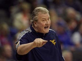 FILE - West Virginia head coach Bob Huggins talks to his players during the first half of an NCAA college basketball game against Texas Tech in the first round of the Big 12 Conference tournament Wednesday, March 8, 2023, in Kansas City, Mo. Former West Virginia men's basketball coach Bob Huggins has entered a 12-month diversion program to resolve a drunken driving arrest. Huggins had been scheduled for a formal arraignment on Thursday, Aug. 17. According to court records in Pittsburgh, that hearing was canceled last month after he was accepted into the program.