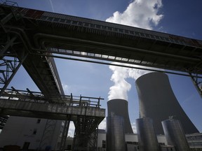 FILE - Equipment frames the cooling towers of the Temelin nuclear power plant near the town of Tyn nad Vltavou, Czech Republic, on Thursday, June 25, 2015. The U.S. and its European allies are importing vast amounts of nuclear fuel and compounds from Russia, providing Moscow with hundreds of millions of dollars in badly needed revenue as it wages war on Ukraine.
