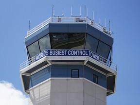 FILE - The control tower sits above the Wittman Regional Airport in Oshkosh, Wis. The daughter of a Super Bowl-winning former NFL player and her co-pilot are among the four people who died last weekend in two separate crashes at the annual Airventure convention which takes place annually at the Wittman Regional Airport.