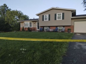 Police tape lines the front yard at a home in Lake Township, Ohio, Friday, Aug. 25, 2023. Police performing a welfare check on the home Thursday, Aug. 24, 2023, found five dead bodies according to Uniontown police. The names of the victims have not been released, pending notification of relatives.