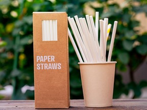 Multiple paper straws in a cup.