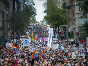 The head of Montreal's LGBTQ+ pride festival organization says the city's pride parade will go on as planned Sunday after its abrupt cancellation last year. Thousands turned out to walk in the Montreal Pride parade, Sunday, Aug. 15, 2021.