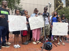 Family members of Ricky Cobb II, a Black man who was shot and killed by a Minnesota State Patrol trooper, speak at a news conference outside Hennepin County Government Center in Minneapolis on Wednesday, Aug. 2, 2023. They joined members of activist groups in demanding that Minnesota's Democratic Gov. Tim Walz fire the three officers who were involved in stopping Cobb on a Minneapolis freeway on Monday, July 31, which led to Cobb's death.