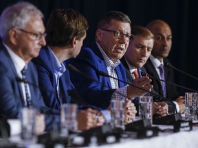 Saskatchewan Premier Scott Moe, third from leftspeaks to media during the closing news conference at the Council of the Federation Canadian premiers meeting at The Fort Garry Hotel in Winnipeg on Wednesday, July 12, 2023.