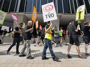 TVO employees and supporters are seen on the picket line outside of TVO offices Toronto, Monday, Aug. 21, 2023. Dozens of workers at the organization walked off the job Monday, saying they haven't been able to reach a reasonable agreement with their employer.