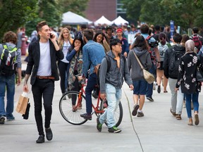 A crowd of university students on campus.