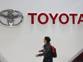 FILE - A boy looks at a logo of Toyota Motor Corp. at its gallery in Tokyo on Jan. 15, 2020. Toyota's profit for the first fiscal quarter jumped to 1.3 trillion yen ($9 billion) -- a quarterly record for Japan's top automaker, as sales grew and parts shortages related to the coronavirus pandemic eased. Toyota Motor Corp.'s April-June, 2023, net profit rose 78% from 736.8 billion yen the previous year, the company reported Tuesday, Aug. 1, 2023.