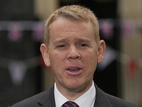 FILE - Prime Minister of New Zealand Chris Hipkins speaks to the media after meeting Britain's Prime Minister Rishi Sunak, in Downing Street, in London, Friday, May, 5, 2023. New Zealand on Monday, Aug. 14, removed the last of its remaining COVID-19 restrictions, marking the end of a government response to the pandemic that was watched closely around the world. Hipkins said the requirement to wear masks in hospitals and other healthcare facilities would end at midnight, as would a requirement for people who caught the virus to isolate themselves for seven days.