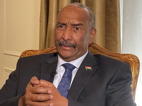 FILE - Sudan's General Abdel-Fattah Burhan answers questions during an interview, on Sept. 22, 2022, in New York. Sudan's top miliary officer is traveling to Egypt on Tuesday, Aug. 29, 2023, in his first trip abroad since his country plunged into a largescale conflict earlier this year, Sudanese authorities said.