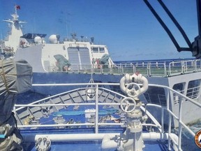 In this photo provided by the Philippine Coast Guard, a Chinese Coastguard ship, front, allegedly blocks the path of a Philippine Coast Guard ship near the Philippine-occupied Second Thomas Shoal, South China Sea during a re-supply mission on Saturday Aug. 5, 2023. The Philippine military condemned on Sunday a Chinese coast guard ship's "excessive and offensive" use of a water cannon to block a Filipino supply boat from delivering new troops, food, water and fuel to a Philippine-occupied shoal in the disputed South China Sea. (Philippine Coast Guard via AP)