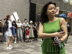 FILE - Cheng Lei, then a Chinese-born Australian journalist for CGTN, the English-language channel of China Central Television, attends a public event in Beijing on Aug. 12, 2020. The Chinese-Australian journalist who worked for China's state broadcaster and was convicted on murky espionage charges has spoken out about the harsh conditions of her detention.