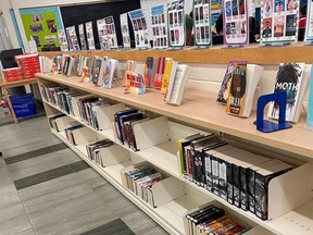 Half-empty book shelves are seen at Erindale Secondary School in Mississauga, Ont., part of the Peel Region District School Board, where books published prior to 2008 were removed from the school library amid confusion around the board's new equity-based book weeding process.