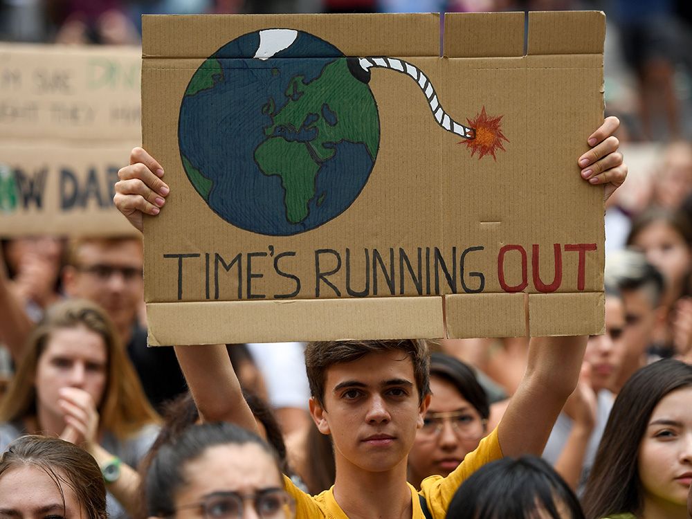 jesse_kline_climate_change_green_energy_technology_sign