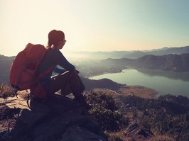 happy woman looking out a beautiful scenery