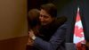 Justin Trudeau hugs Jacinda Ardern.